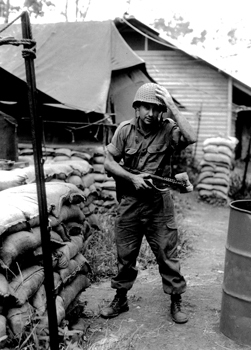 Sapper Terry Lorraine outside accommodation tent after transport patrol, 17 construction unit, Nui Dat, 1968 (Image courtesy James Lorraine, photograph reproduced by Neville Foster, 1997) Silver gelatin print 30.3 x 40.5cm